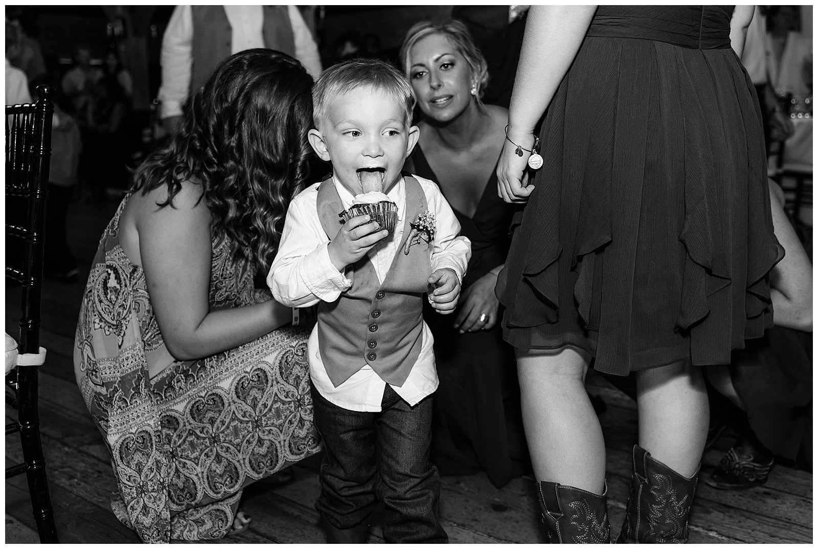 Ring bearer eating a cupcake at a red lion inn wedding on the south shore