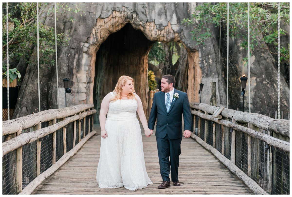 bride and groom portraits on bridge at palm beach zoo wedding