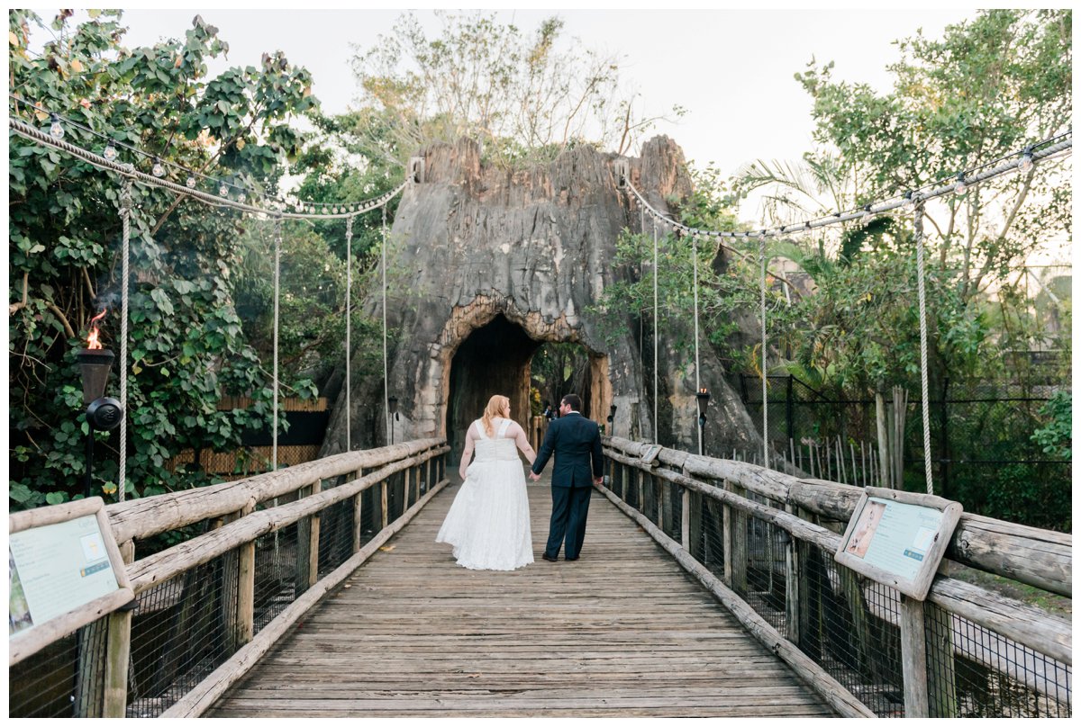 bride and groom portraits on bridge at palm beach zoo wedding