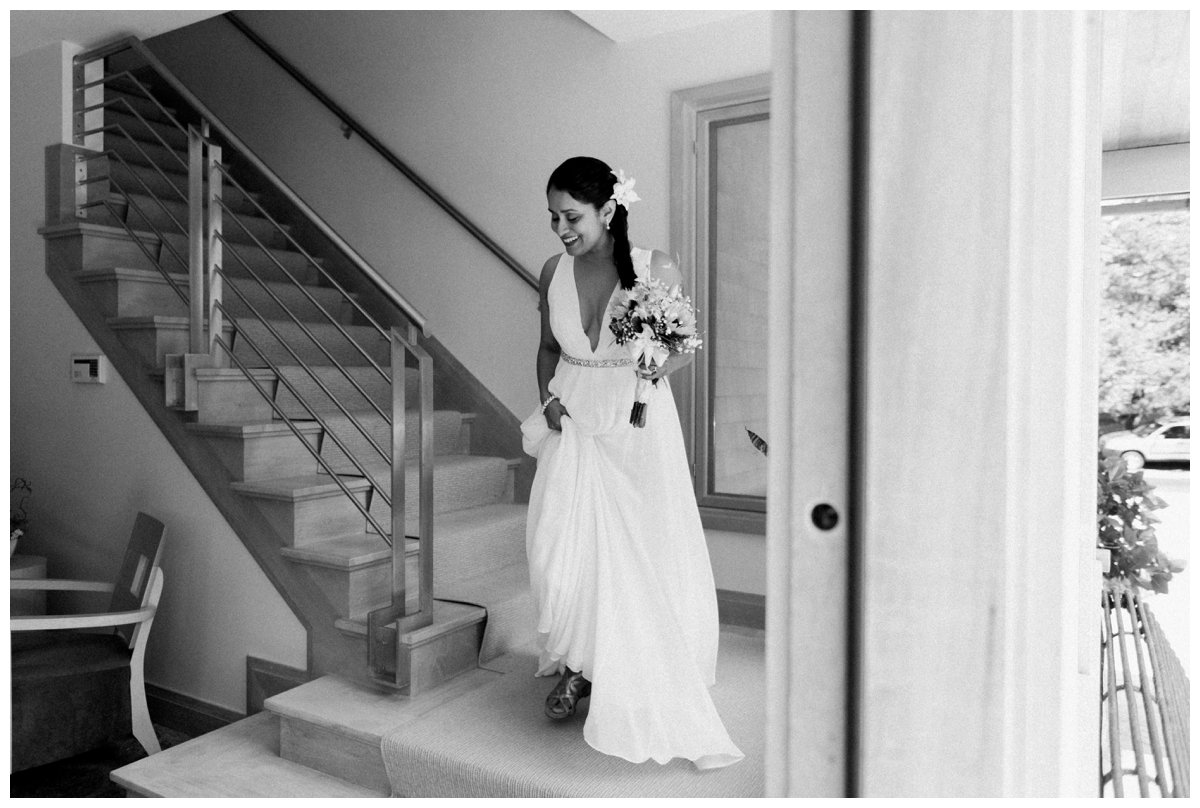bride coming down the stairs at a falmouth beach wedding