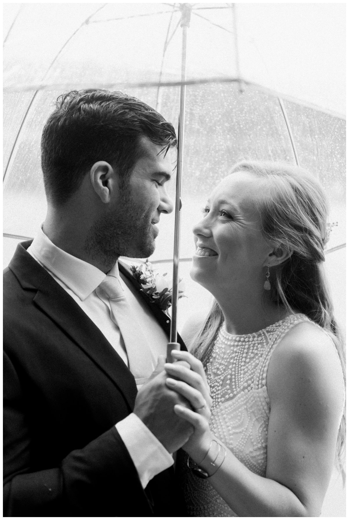 Warren Conference wedding bride and groom portrait rain umbrella