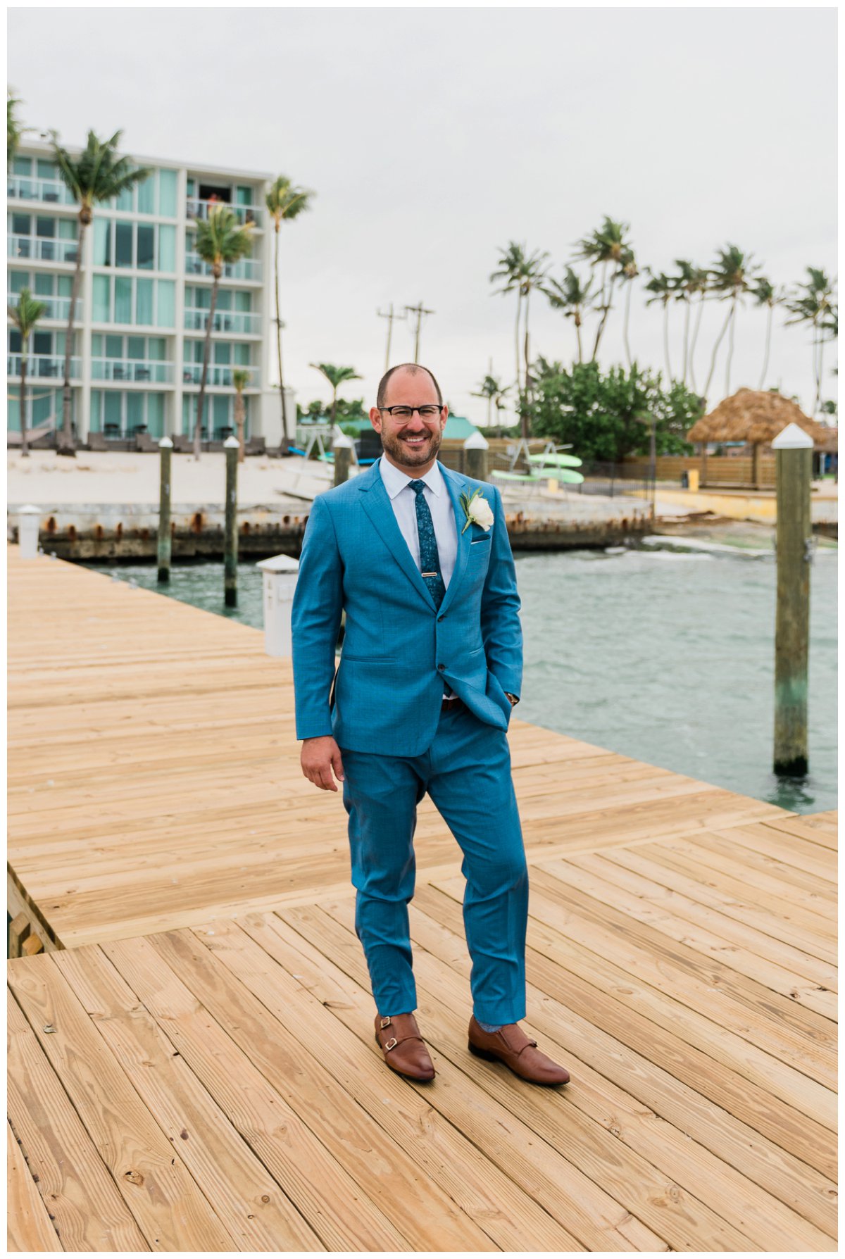 groom prepares for first look in amara cay