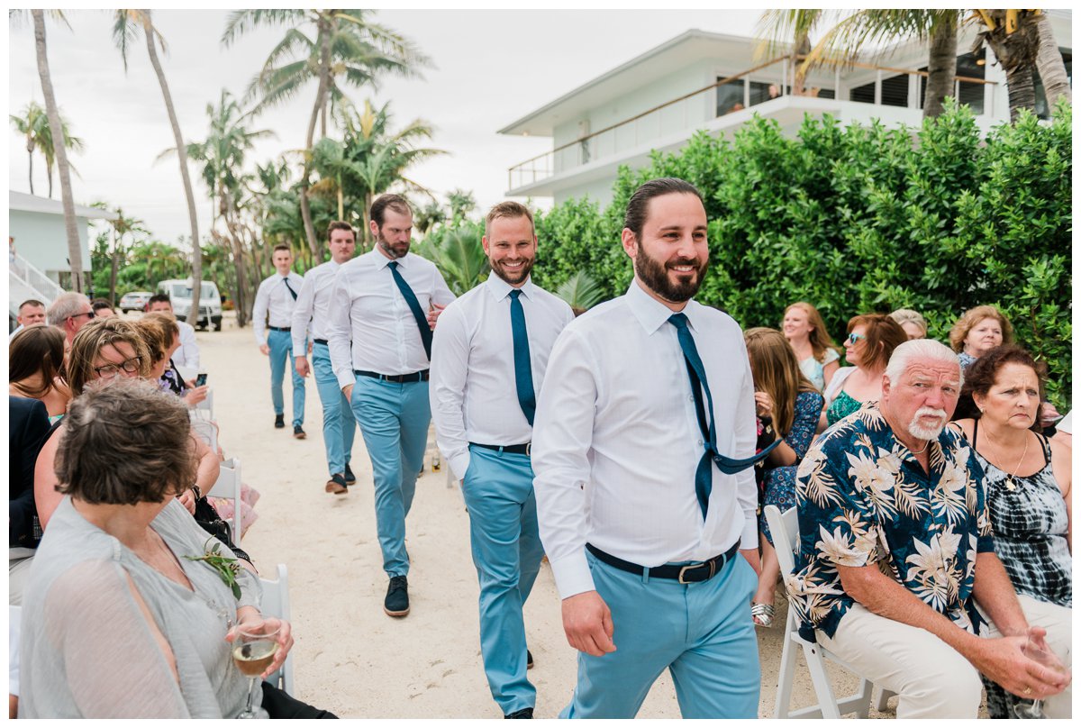 the groom and groomsmen arrive at the ceremony