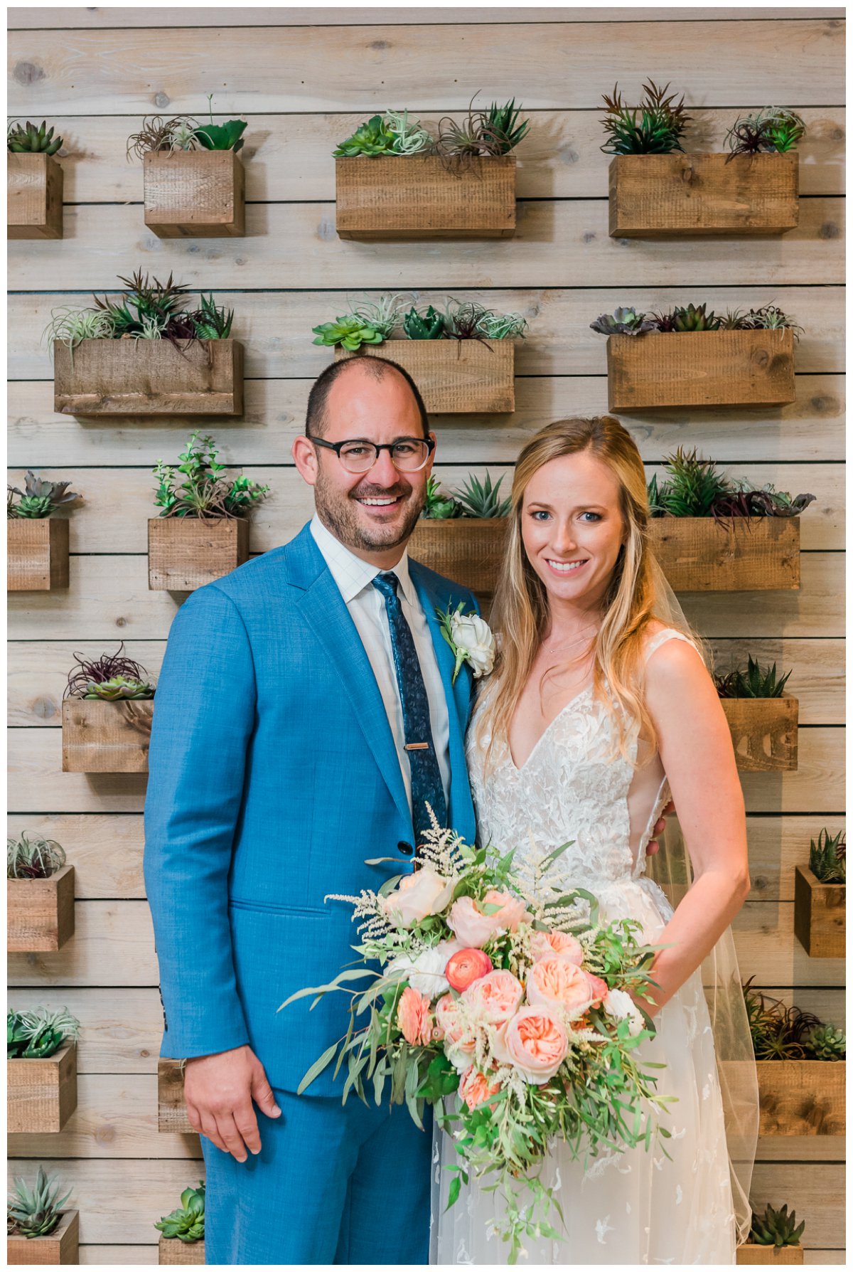 bride and groom portraits in front of pretty succulents at amara cay resort