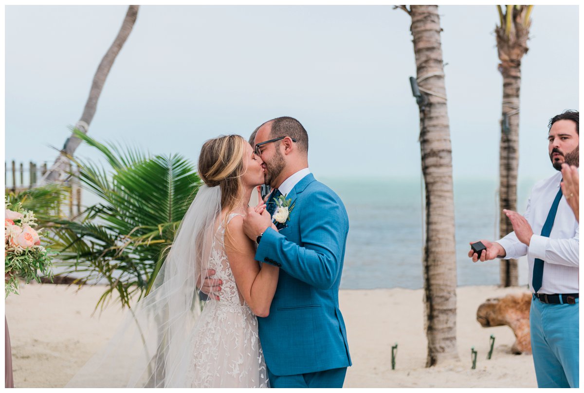 First kiss at a wedding at the islamorada beach house in the florida keys