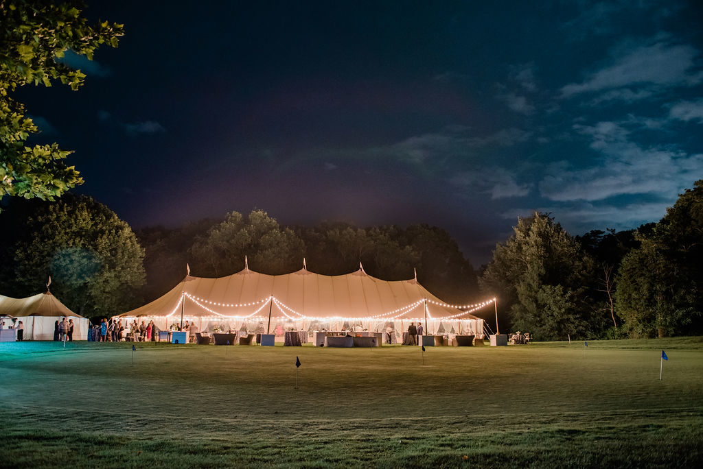 Sperry tent wedding at night