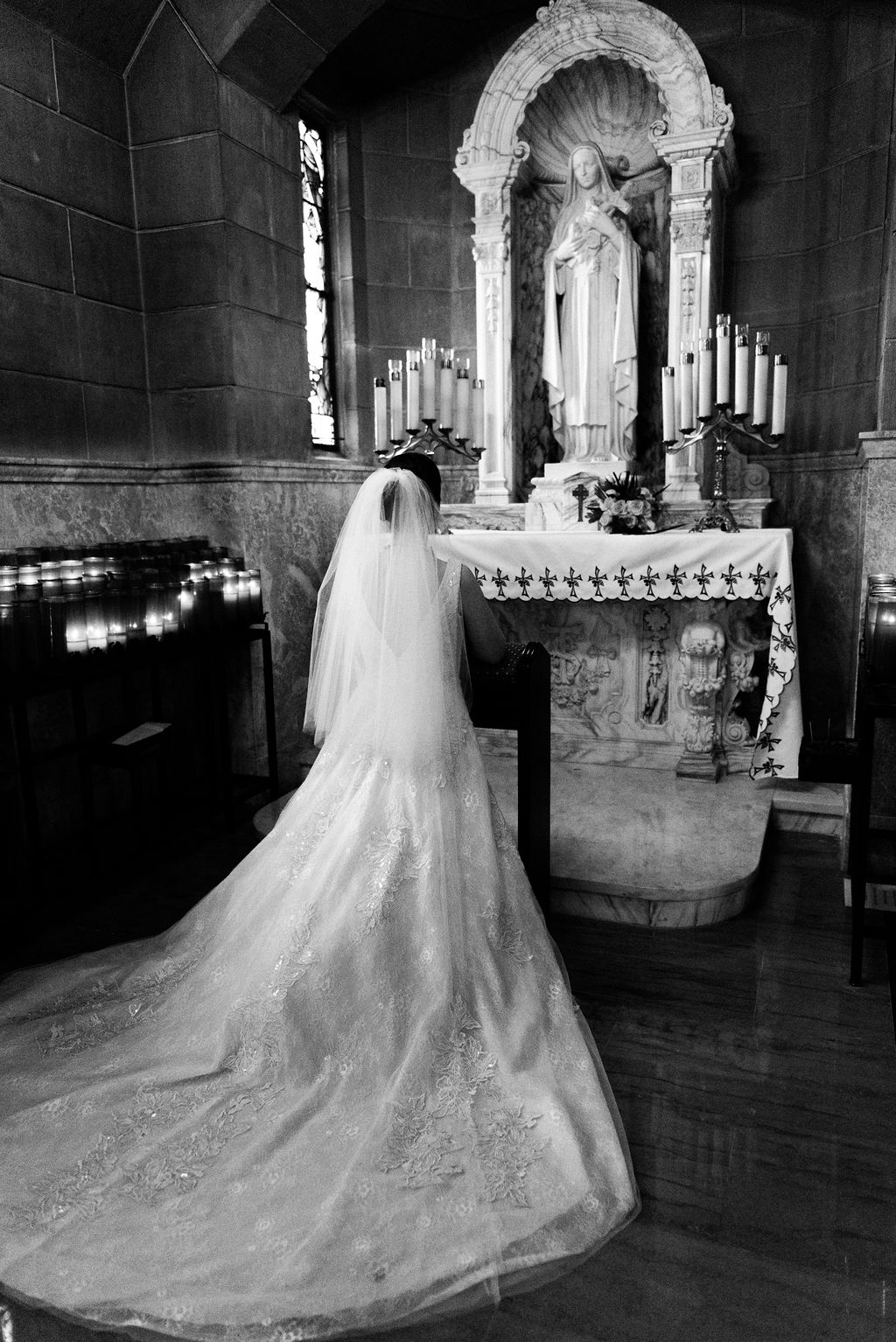 Bride praying at St Edward's church Palm Beach