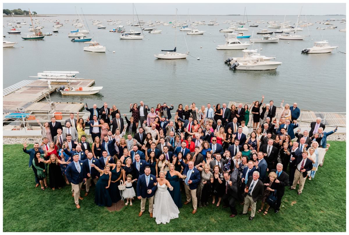 big group photo at a duxbury bay maritime school wedding