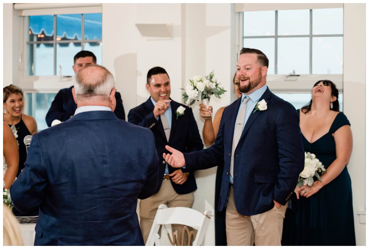 groom reacts to the father of the bride's toast