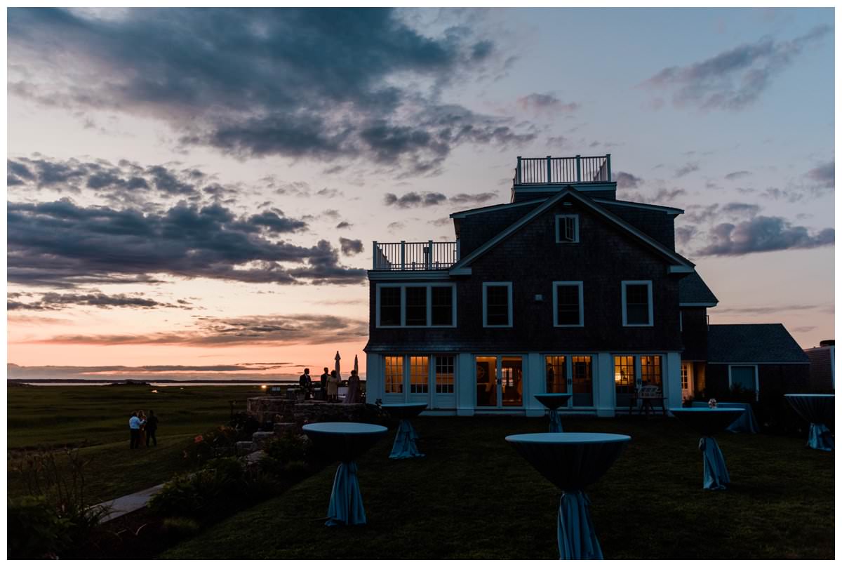 sun sets at a gurnet point wedding at a private residence