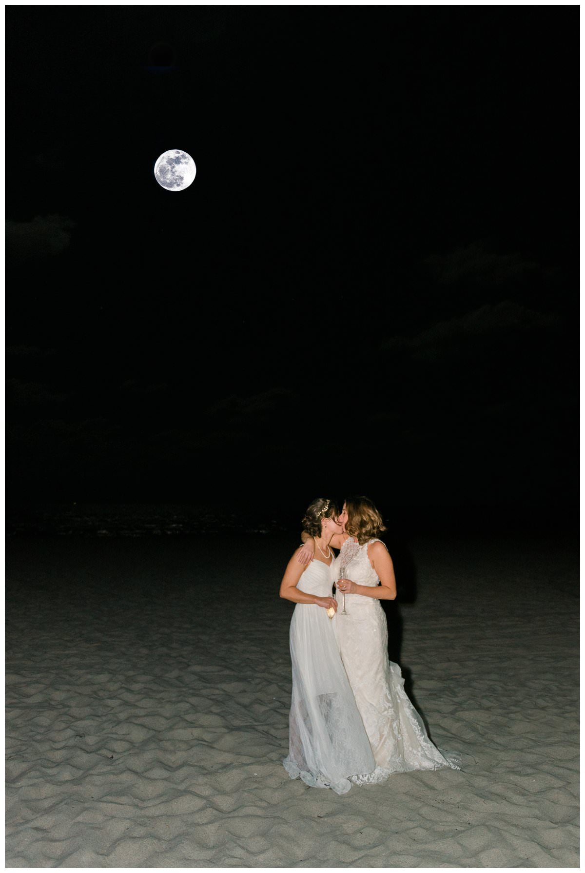 wedding photo on the beach under full moon