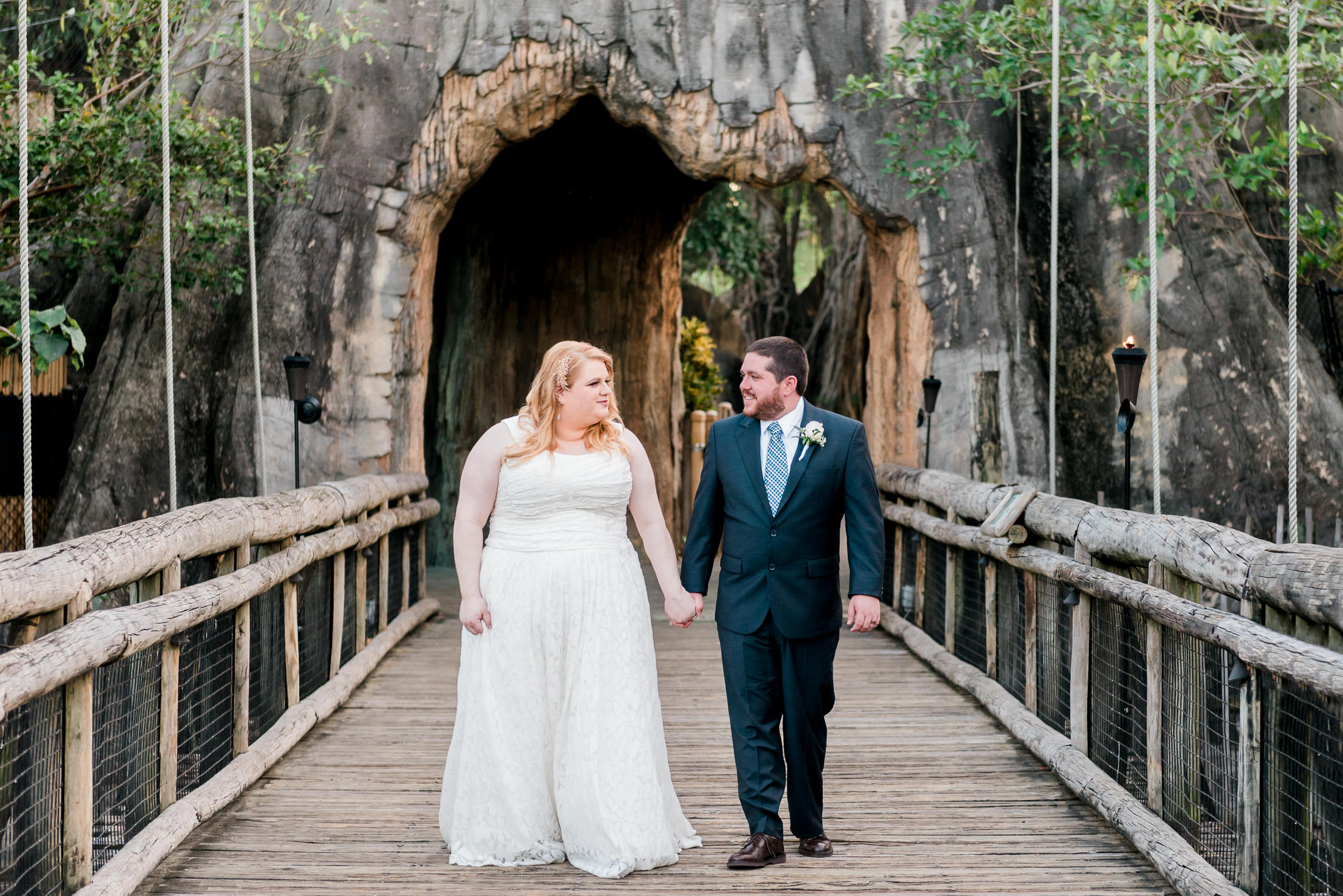 A wedding couple takes portraits at their palm beach zoo wedding.