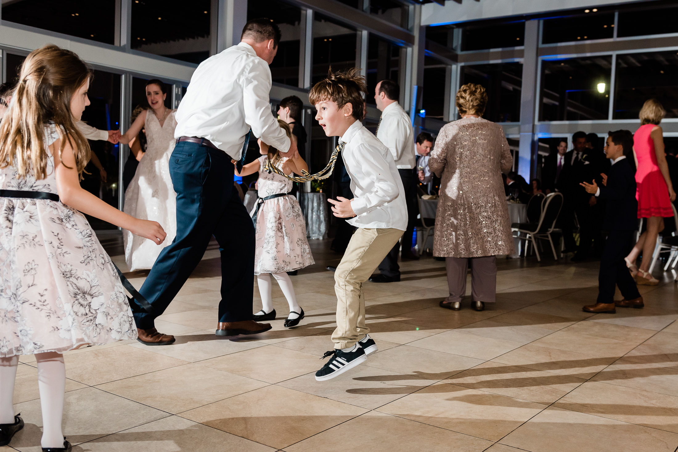 Kid dancing at lake pavilion wedding