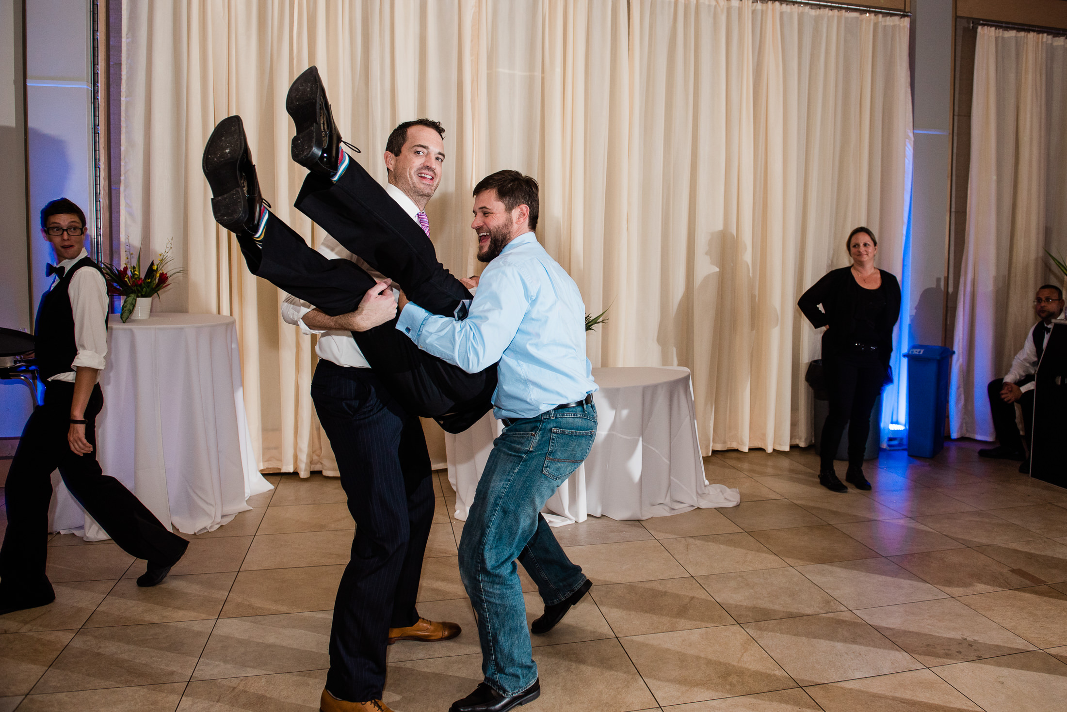 guests lifting groom at lake pavilion wedding west palm beach