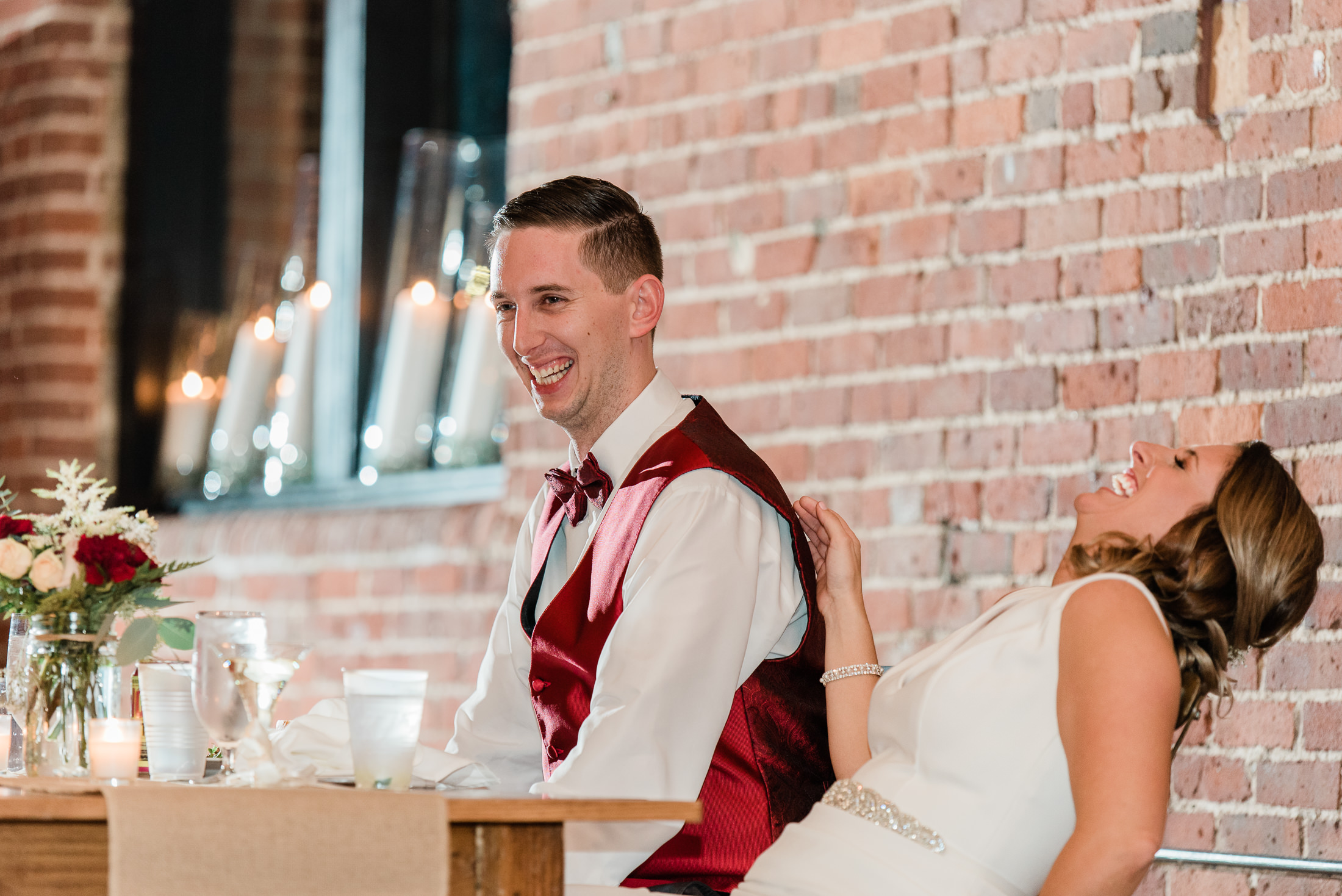 Reactions to a wedding toast at Charles river museum wedding in Waltham MA