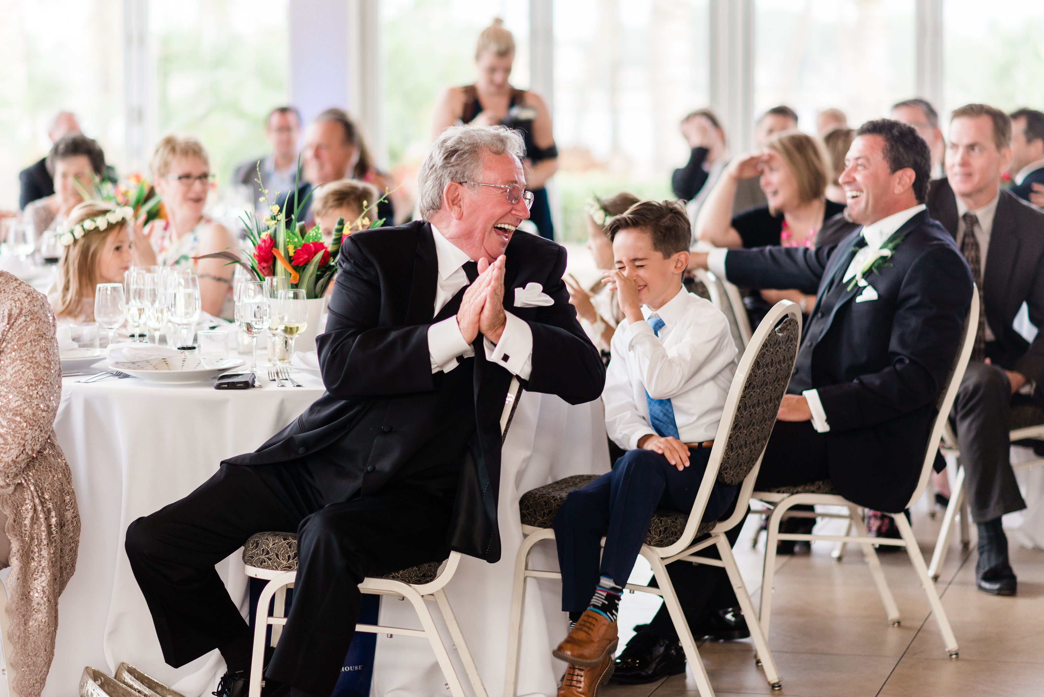 wedding guests enjoying the humorous toast