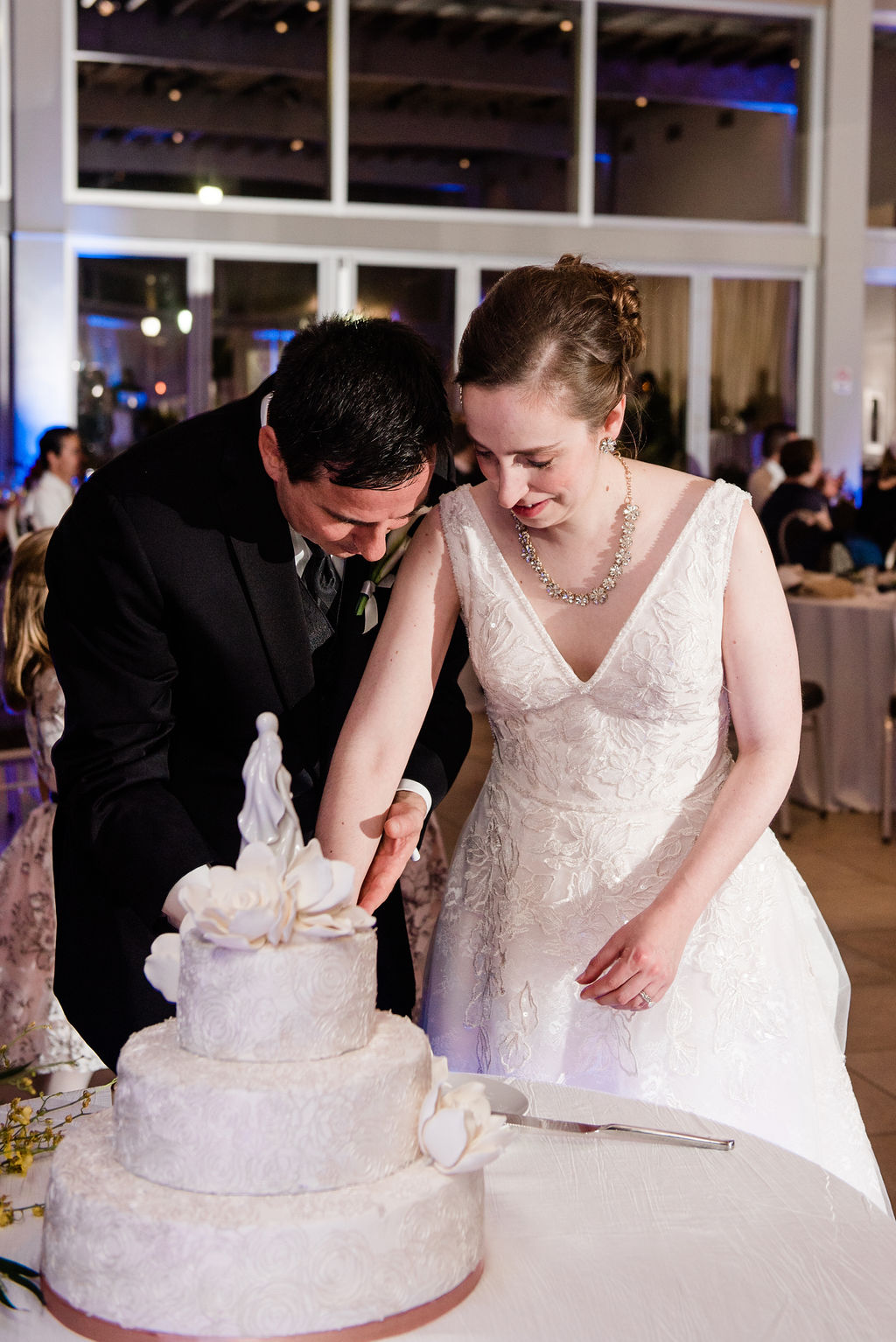 bride and groom cut the wedding cake at Lake Pavilion West Palm Beach